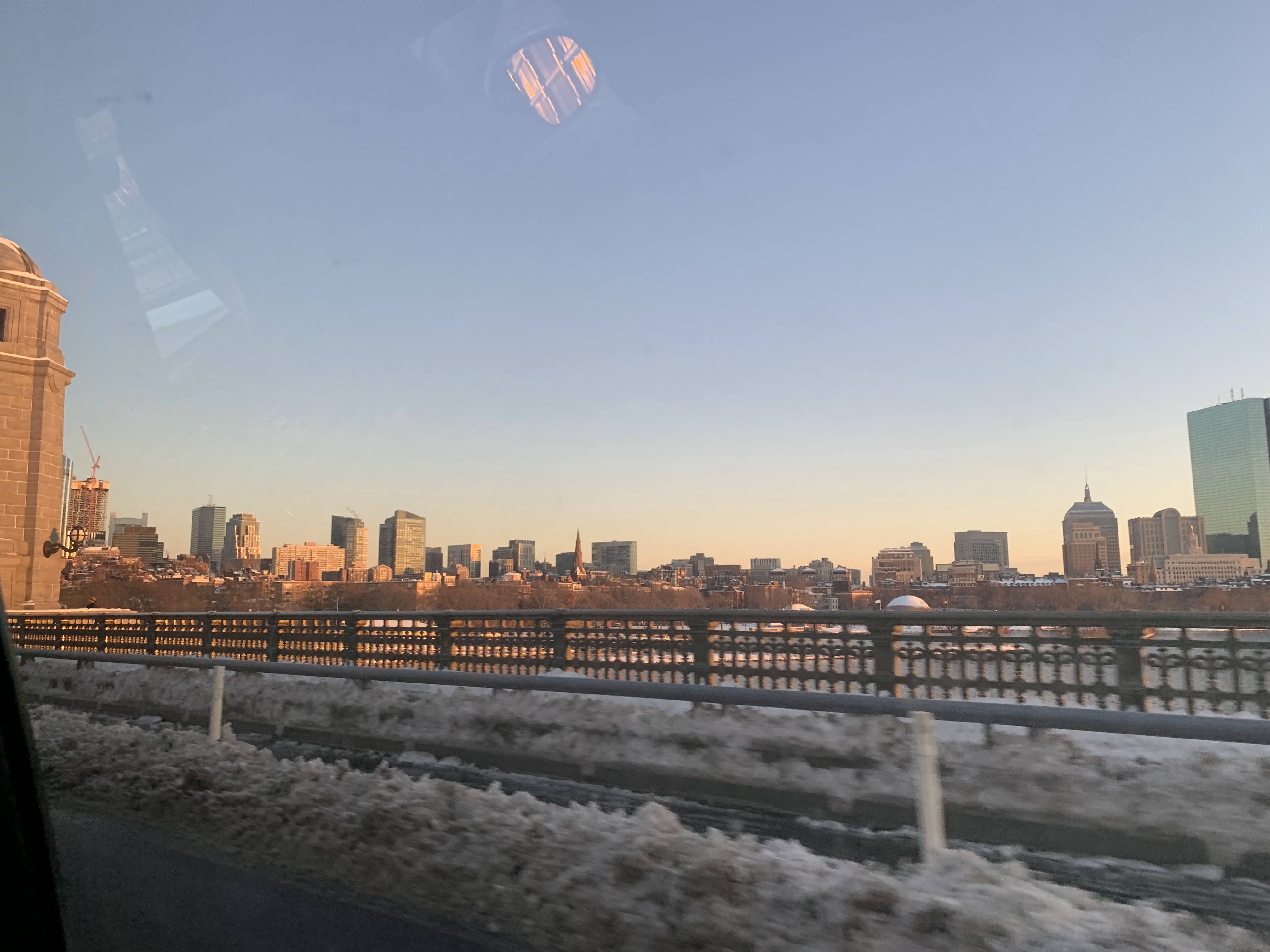 The Charles basked in orange glow on a leftover snowy day.